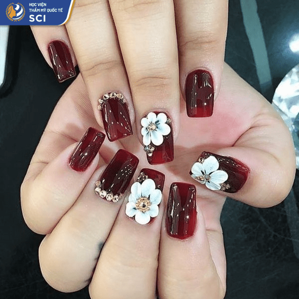 Mẫu nail đính đá màu đỏ rượu vang đơn giản mà quyến rũ - hoidapnails.com